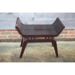 A Chinese lacquered hardwood 'X' frame stool with panel seat, on splay supports, 27 1/4" wide x 13
