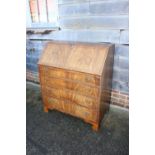 A 19th century figured mahogany fall front bureau with fitted interior over four long graduated