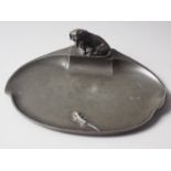 A WMF pen tray with dachshund and lizard, 9" wide (misshapen edge)