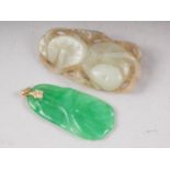 A pale celadon jade carving of two lily pads, and a green coloured pendant