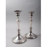 A pair of filled silver candlesticks, 9 1/2" high