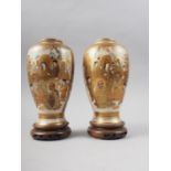 A pair of Satsuma figure decorated oviform vases with signature marks to base, 7" high, on