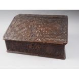 A 17th century chip carved oak table top desk with all-over geometric design, 17" wide x 11" deep