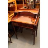 A mahogany desk, fitted pigeonholes over pull-out tooled lined writing surface and one long