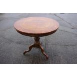 A 19th century Italian walnut and marquetry circular top occasional table with St George and the