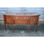 A 19th century mahogany break bowfront sideboard, fitted two central drawers flanked cupboards, on