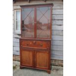 A 19th century mahogany secretaire bookcase, the upper section enclosed lattice glazed doors over