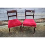 A pair of 19th century mahogany bar back standard dining chairs, upholstered in a crimson Draylon,