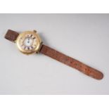 An 18ct gold and enamelled "Half Hunter" wristwatch, on leather strap