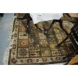 A Persian garden style rug, in shades of blue, brown, fawn, green and natural, 77" x 56" approx