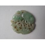 A phoenix carved jade panel, 2 3/4" high, a dragon pierced jade panel, 2 1/4" high, and a smaller