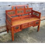 An antique Chinese and hardwood seat with lattice decorated sides and back over four drawers, on
