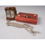 A Pontifa 17 Jewel travelling clock, in leather case, a white metal Albert chain, stamped "Sterling"