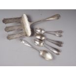 An Egyptian white metal pastry slice, 4.5oz troy, six Continental scroll embossed teaspoons and a
