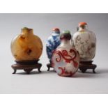 A Chinese internal painted snuff bottle with coral stopper, 2 3/8" high, a blue and white