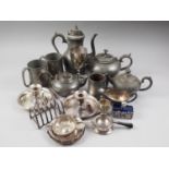 A quantity of pewter, including three teapots, a coffee pot, other pewter, a silver plated