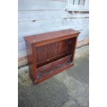 A mahogany bookcase with two shelves, on block base, 33" high x 41 3/4" wide