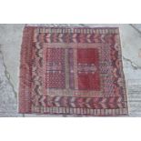A Tekke Hatchli rug in traditional shades, 47" x 55" approx (restored)