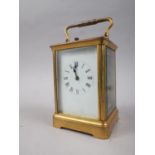 A gilt metal cased hour repeater carriage clock, 5 1/2" high