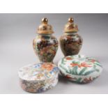 A pair of Satsuma figure decorated jars and covers, 10" high, a Japanese porcelain Imari palette box