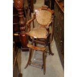 A child's 19th century oak 1875 patent metamorphic highchair with feeding tray