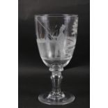 An early 19th century glass goblet with engraved fisherman decoration, 11 1/2" high, a Brierley