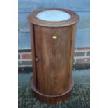 A late 19th century mahogany and marble top cylindrical bedside cupboard enclosed one door, 15"