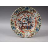 A Chinese polychrome plate with tree and fence design, 9 1/4" dia, a Satsuma figure decorated plate,