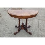 A Victorian burr walnut and inlaid semicircular fold over top card table, on turned and carved