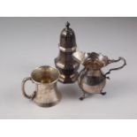 A silver sugar sifter, a silver cream jug and a silver christening mug, 9.7oz troy approx