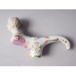 A German porcelain cane, handle formed as the bust of a female, 4 3/4" long x 2 7/8" high
