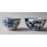 Two late 18th century Worcester blue and white tea bowls with floral decoration (larger 3 1/8" dia)