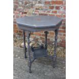 An octagonal painted walnut two-tier occasional table, on turned supports, 23" dia x 27" high, and