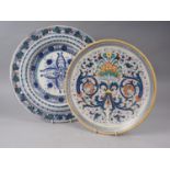 A Mariucci Deruta polychrome enamel charger with traditional grotesque decoration, 14" dia, and a