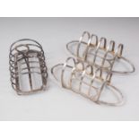 A pair of silver four-division toast racks and a Victorian silver six-division toast rack, 9.9oz