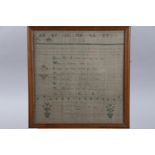 An early 19th century verse sampler, by Ann Adam 1824, 13" x 12 3/4", in strip frame, and an early