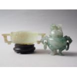A carved jade two-handled vessel, 4 1/8" wide, on hardwood stand, and a carved jade two-handled