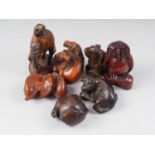 Two carved hardwood horse netsuke, a dog, a ram, two birds and a pair of carp