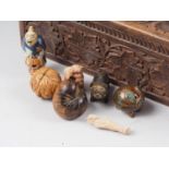 An Oriental carved hardwood box, 12" wide, a Kobe "Daruma" doll toy, 1 3/4" high, a carved walnut
