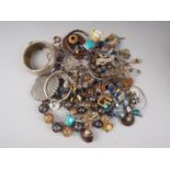A quantity of costume jewellery, including beaded necklaces, ear clips, pendants and other items