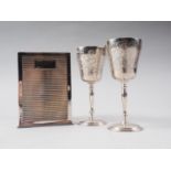 A pair of silver goblets with engraved decoration, 4 3/4" high, 4.8oz troy approx, and a Links of