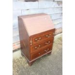 An early 20th century walnut and satinwood banded fall front bureau with fitted interior over
