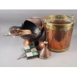 A copper and brass log pail, 13" high, a copper coal scuttle, a pair of copper fire bellows, a