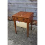 An early 19th century faded rosewood and inlaid work table, fitted one drawer and well, on square