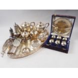 A silver plated oval gallery tray, a plated four-piece tea and coffee service and other plate