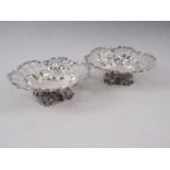 A pair of pierced silver bonbon dishes, on scroll feet, 6.5oz troy approx