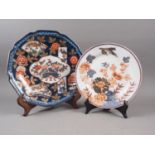An Imari shaped dish with traditional decoration, 12 1/2" wide, and a similar plate, 10" dia