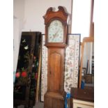 An early 19th century provincial oak long case clock with painted dial, swan neck pediment and