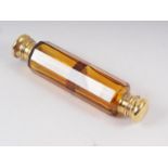 A 19th century amber glass double ended scent and salts bottle with gilt metal mounts, 5" long