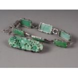 A Chinese floral carved green jade and white metal mounted brooch and a similar bracelet